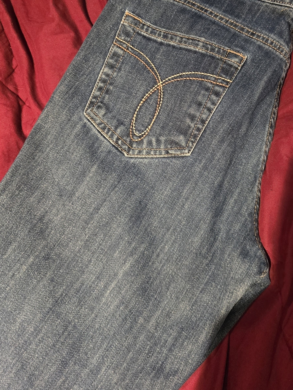 Calvin Klein Light Blue Denim Jeans with Curved Pocket Stitching